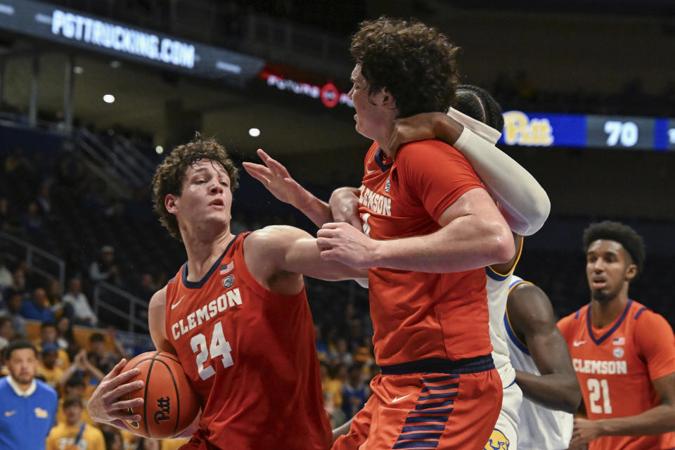 Clemson center PJ Hall (24) pulls down a rebound against Pittsburgh during the second half of an NCAA college basketball game, Sunday, Dec. 3, 2023, in Pittsburgh. (AP Photo/Barry Reeger)