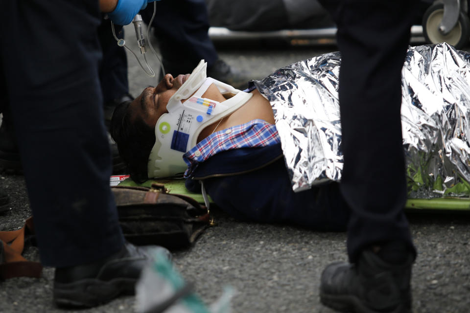 <p>An injured passenger is treated after a New Jersey Transit train crashed into the platform at Hoboken Terminal during morning rush hour September 29, 2016 in Hoboken, New Jersey. (Eduardo Munoz Alvarez/Getty Images) </p>