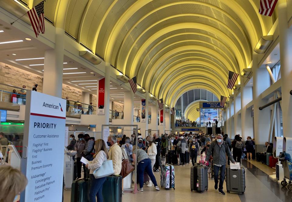 Passengers check in at the American Airlines counters at the Los Angeles International Airport (LAX) on April 24, 2021. (Photo by Daniel SLIM / AFP) (Photo by DANIEL SLIM/AFP via Getty Images)