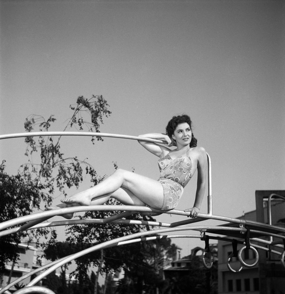 Posing in a swimsuit in a recreational&nbsp;park in Rome in 1949.