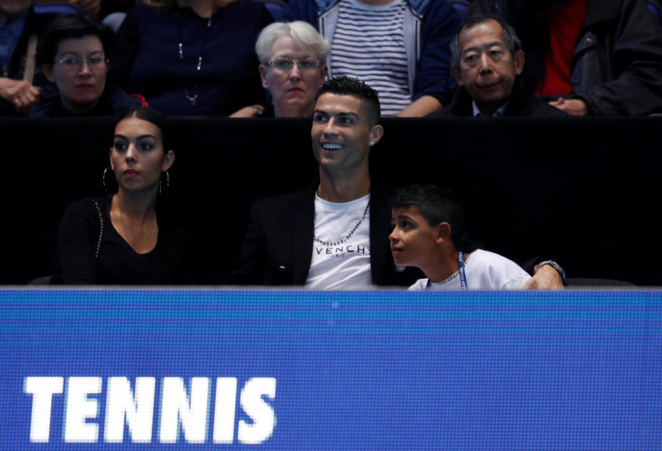 Tennis – ATP Finals – The O2, London, Britain – November 12, 2018 Juventus’ Cristiano Ronaldo and family watch the group stage match between Serbia’s Novak Djokovic and John Isner of the U.S. REUTERS/Peter Nicholls