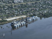 CAPTION CORRECTS LOCATION - Grain storage sits underwater after the collapse of the Kakhovka Dam, in Kozatske, in Russian-occupied Ukraine, Wednesday, June 7, 2023. (AP Photo)