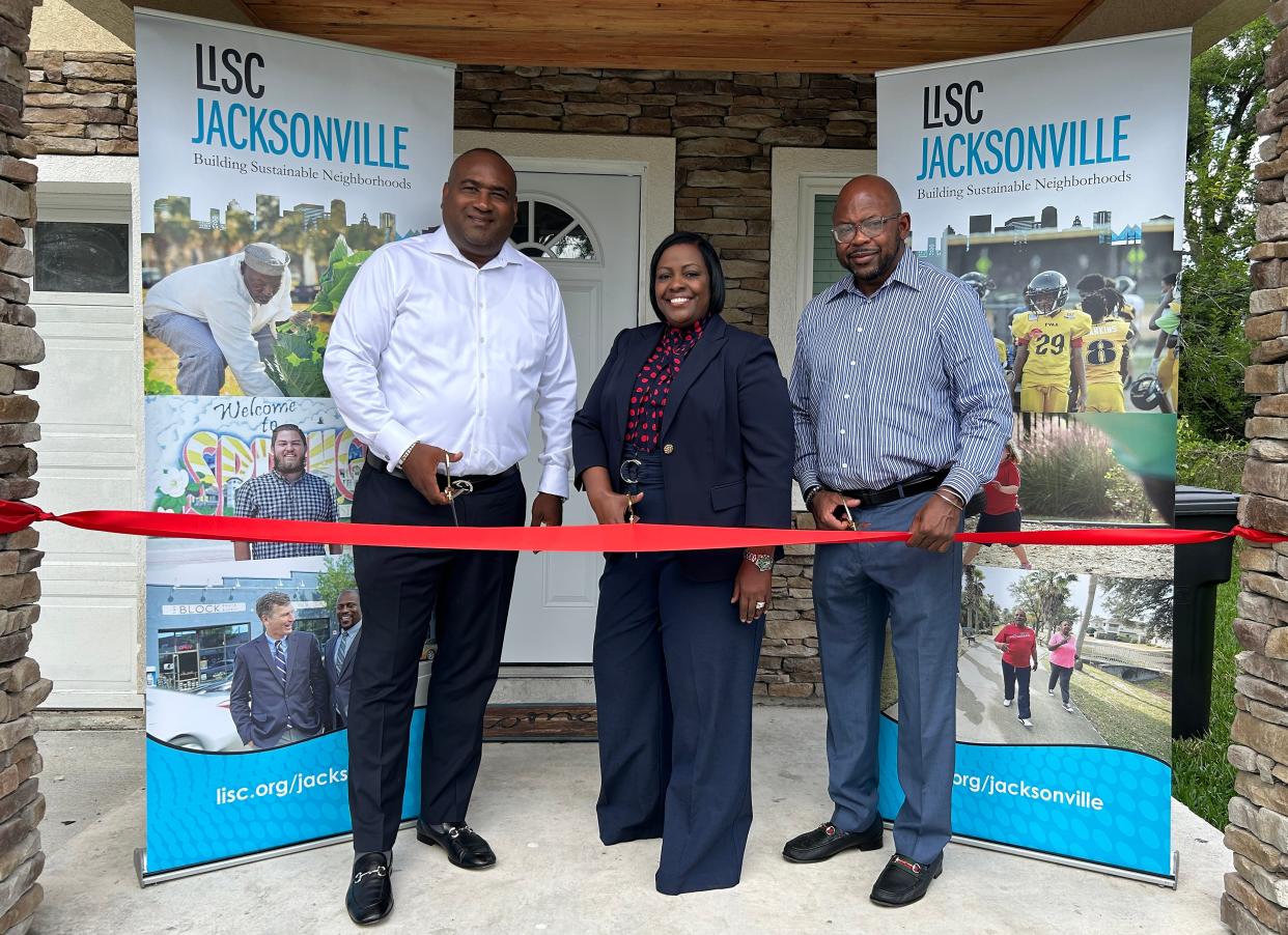In April, LISC Jacksonville Executive Director Irvin "PeDro" Cohen, right, celebrated the first home closing for the nonprofit's Project Boots homeownership program with developers Terry Hardmon of The Hardmon Co. and Carmen Williams of In the Word International Ministry.