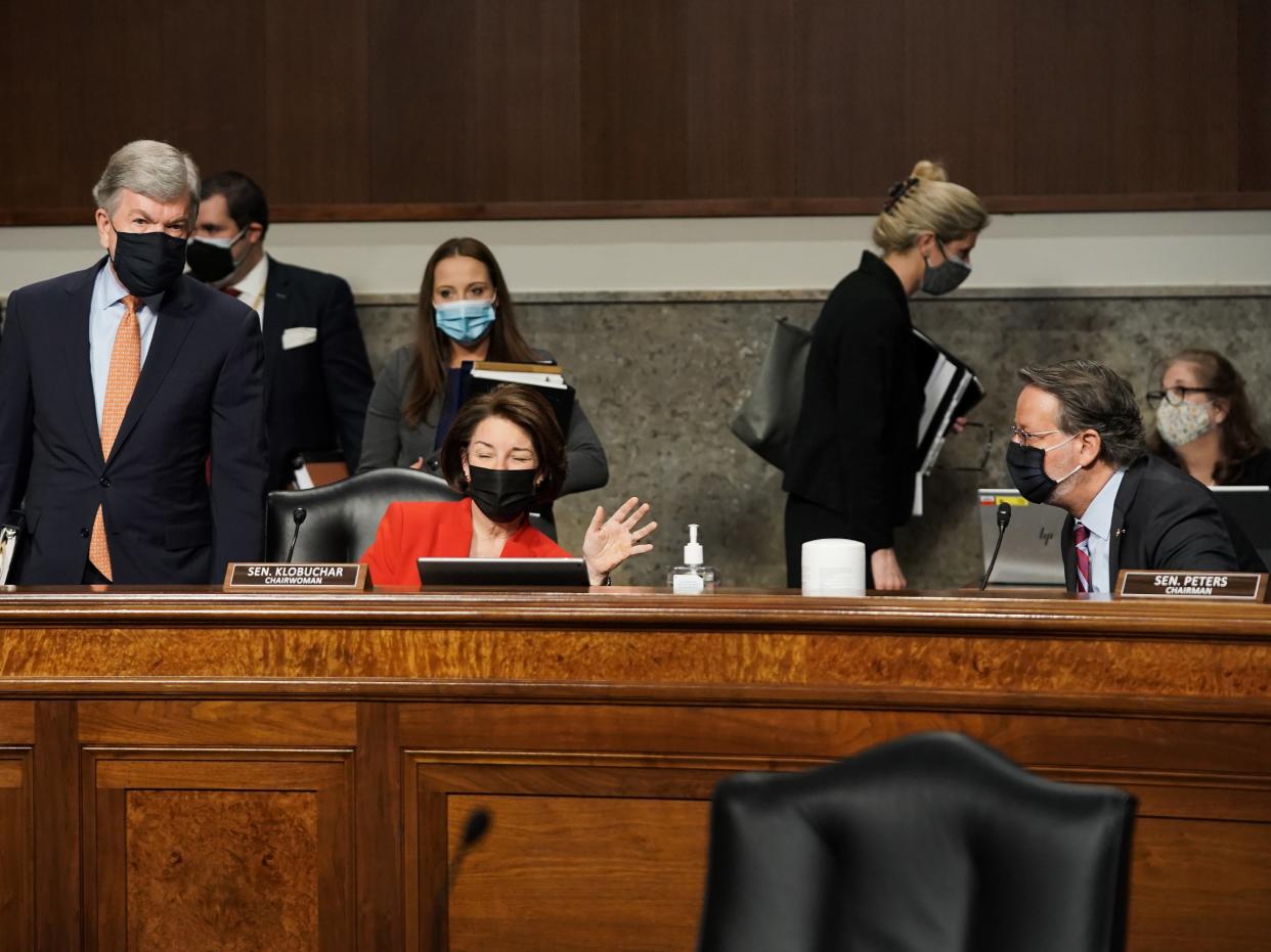 Sens. Roy Blunt, Amy Klobuchar, and Gary Peters are seen prior to a hearing on March 3, 2021 in Washington, DC.   (Getty Images)