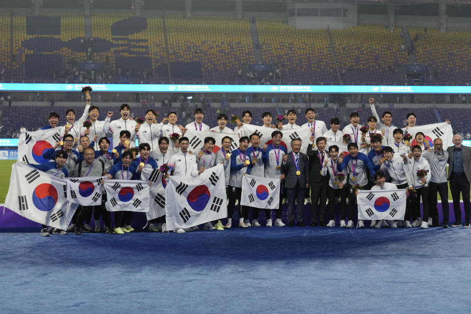 Gold medalist Team South Korea celebrates on the podium during the victory ceremony for the men's soccer at the 19th Asian Games in Hangzhou, China, Saturday, Oct. 7, 2023. (AP Photo/Aijaz Rahi)