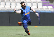 India's captain Virat Kohli dives to catch the ball during a training session ahead of their Cricket World Cup match against South Africa at Ageas Bowl in Southampton, England, Saturday, June 1, 2019. (AP Photo/Aijaz Rahi)