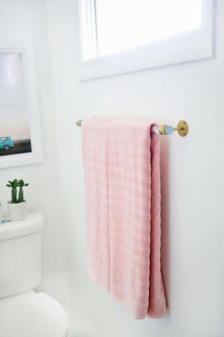 <p><a href="https://abeautifulmess.com/lucite-towel-bar-diy/" data-component="link" data-source="inlineLink" data-type="externalLink" data-ordinal="1">A Beautiful Mess</a></p>