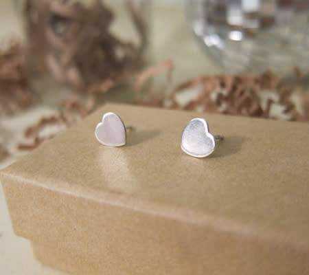 <div class="caption-credit"> Photo by: Estu Jewelry</div><b>Handmade Heart Earrings for Little Ladies</b> <br> These tiny sterling silver handmade heart earrings are so precious. Does your little girl have pierced ears? These would be oh-so-cute for Valentine's Day -- and all year round! <br> <i><a href="http://www.disneybaby.com/blog/wear-your-heart-on-your-sleeve-20-adorable-handmade-heart-accessories/#slide5" rel="nofollow noopener" target="_blank" data-ylk="slk:Get it here;elm:context_link;itc:0;sec:content-canvas" class="link ">Get it here</a></i> <br>