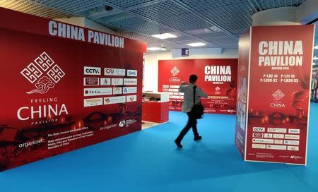 A visitor walks past the China pavillon during the annual MIPCOM television programme market in Cannes, France, October 17, 2016. REUTERS/Eric Gaillard