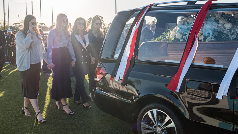 Danny Frawley's wife and daughters, pictured here following his hearse.