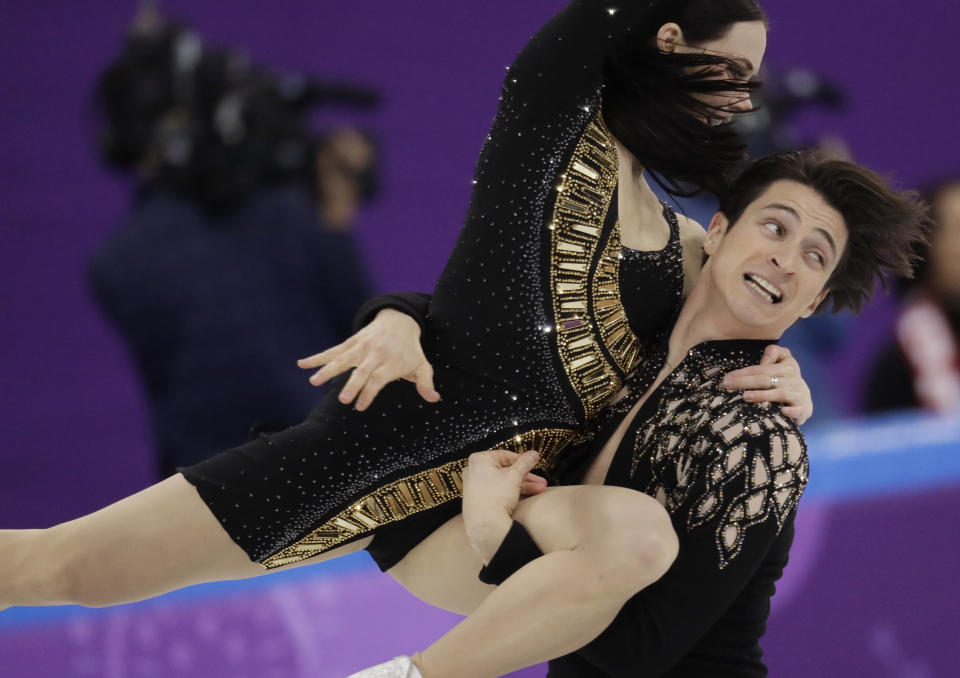 FILE -Tessa Virtue and Scott Moir of Canada perform during the ice dance short dance team event in the Gangneung Ice Arena at the 2018 Winter Olympics in Gangneung, South Korea, Sunday, Feb. 11, 2018. Skate Canada has dropped the requirement that an ice dance or figure skating pairs team competing domestically must include a man and a woman.(AP Photo/Bernat Armangue, File)