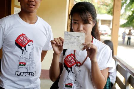 Student leader and anti-war activist Sut Seng Htoi shows a fine receipt for holding a protest outside a court in Myitkyina, while Myanmar's military still fighting Kachin Independence Army (KIA) in the country's northern Kachin State, Myanmar May 9, 2018. REUTERS/Ann Wang