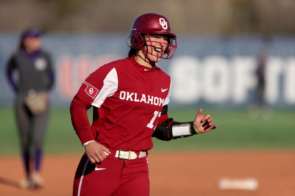 Oklahoma's Sophia Nugent (17) runs home after hitting a home run in the second inning of a college softball game between the University of Oklahoma Sooners (OU) and the Weber State Wildcats at USA Softball Hall of Fame Stadium in Oklahoma City, Saturday, March 18, 2023. 