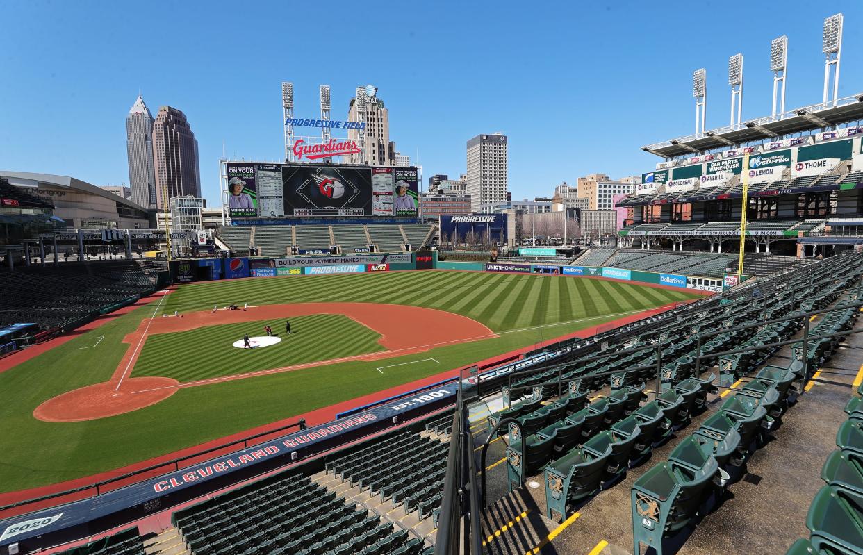 Members of the Cleveland Guardians take care of the field before last season's March 30 home opener at Progressive Field. This season's home opener will coincide with the April 8 total solar eclipse.