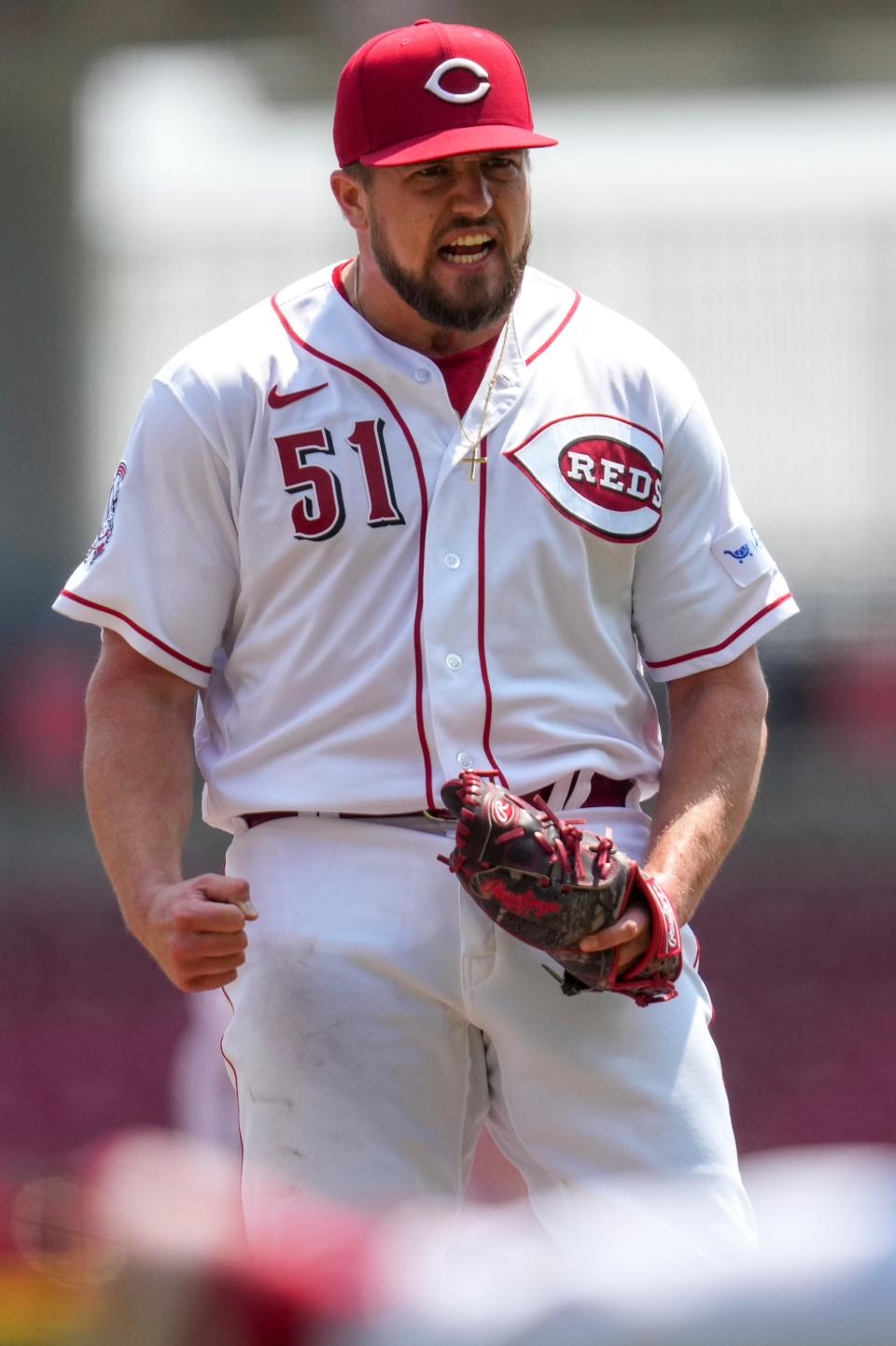 Cincinnati Reds starting pitcher Graham Ashcraft celebrates after getting out of a jam against the Texas Rangers.