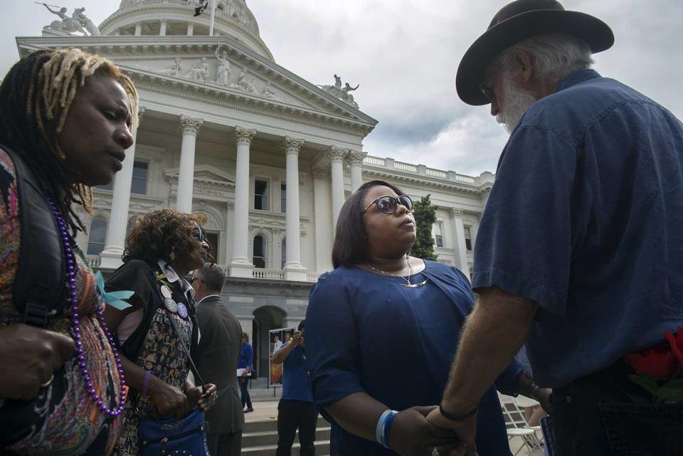 Dr. Nicole Clavo greets several supporters during a rally sponsored by Victims Rights United of California on the west steps of the state Capitol in Sacramento on Thursday, April 7, 2016. In November of 2015 Clavo’s son - J.J. Clavo - was shot and killed on his way to a football game at Grant High School in Sacramento. Randall Benton/Sacramento Bee file