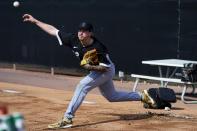 Chicago White Sox pitcher Mike Clevinger throws during an MLB spring training baseball practice, Saturday, Feb. 18, 2023, in Phoenix. (AP Photo/Matt York)