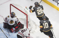 Chicago Blackhawks goalie Corey Crawford (50) looks back after a goaly by Vegas Golden Knights' William Carrier (28) during the second period in Game 1 of an NHL hockey Stanley Cup first-round playoff series, Tuesday, Aug. 11, 2020, in Edmonton, Alberta. (Jason Franson/The Canadian Press via AP)