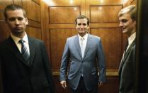 U.S. Senator Ted Cruz (R-TX) (C) departs the Senate floor after a late-night vote rejected budget legislation from the Republican-controlled House of Representatives at the U.S. Capitol in Washington, September 30, 2013. The U.S. government was on the edge of a major shutdown as Congress remained in partisan deadlock on Monday over Republican efforts to halt to President Barack Obama's healthcare reforms using a temporary spending bill. REUTERS/Jonathan Ernst (UNITED STATES - Tags: POLITICS BUSINESS)