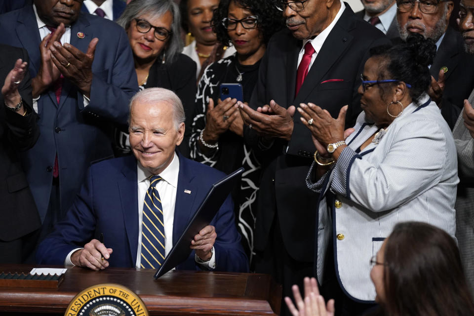 President Joe Biden signs a proclamation to establish the Emmett Till and Mamie Till-Mobley National Monument, in the Indian Treaty Room on the White House campus, Tuesday, July 25, 2023, in Washington. (AP Photo/Evan Vucci)