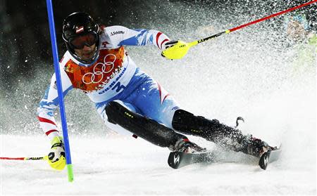 Austria's Mario Matt skis to finish first during the second run of the men's alpine skiing slalom event at the 2014 Sochi Winter Olympics at the Rosa Khutor Alpine Center February 22, 2014. REUTERS/Ruben Sprich