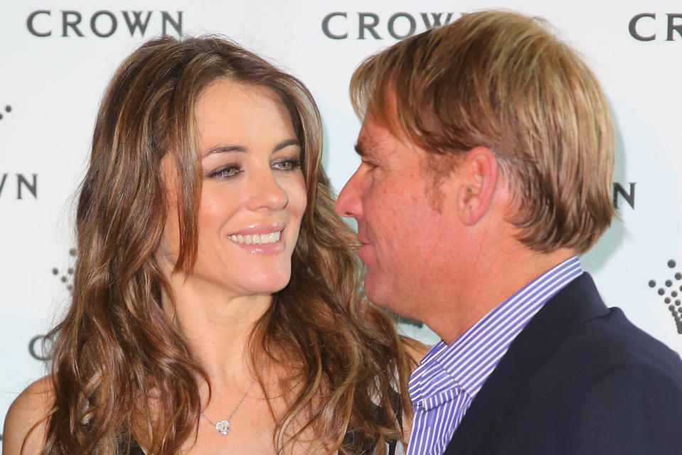 MELBOURNE, AUSTRALIA - NOVEMBER 12:  Shane Warne and Elizabeth Hurley pose as they attend the launch of the Shane Warne Foundation's Ambassador Program at Club 23 on November 12, 2013 in Melbourne, Australia.  (Photo by Scott Barbour/Getty Images)
