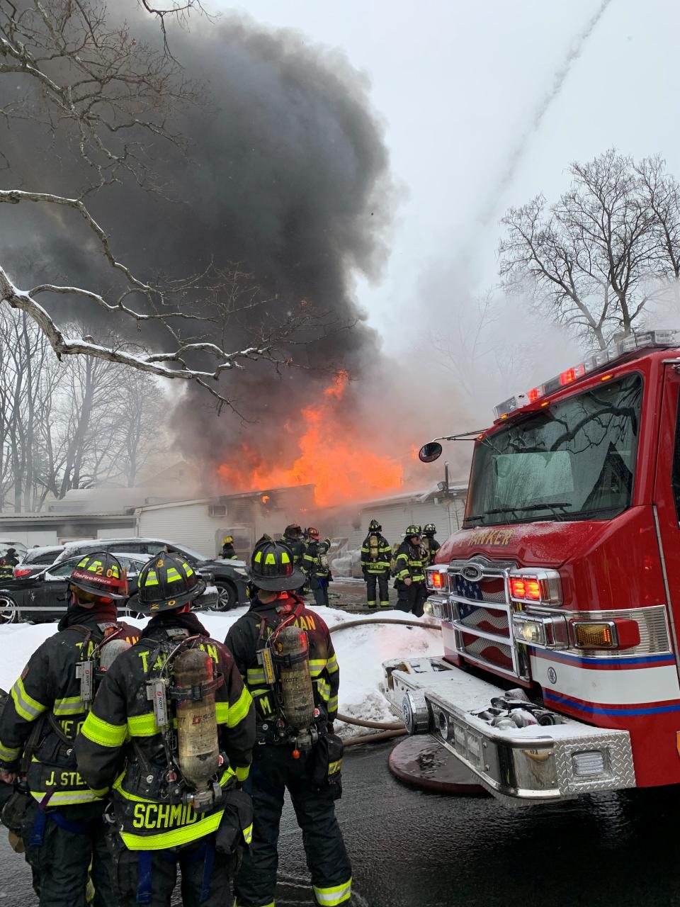 Members of the Tallman Fire Department on the scene of the Motty's Supermarket fire in Monsey on Feb. 18, 2021. The market's owner had run afoul of Town of Ramapo building inspectors for years, racking up violation after violation at a site where shipping containers were added to the back of the building. When conditions worsened, firefighters were pulled out of the building.