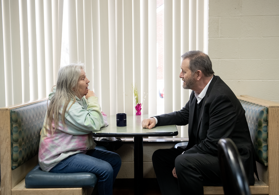 Ohio Attorney General Dave Yost, right, speaks with Kathy Miller during a visit Thursday, March 7, 2024 at Center of Hope in Ravenna. Yost visited the center, which received a portion of a $1 million settlement with Dollar General.