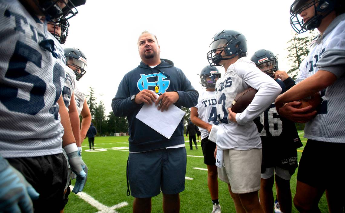 Gig Harbor head coach Darrin Reeves directs the Tides during preseason football practice at Gig Harbor High School in Gig Harbor, Washington, on Friday, Aug. 23, 2024.