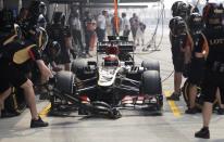 Lotus F1 Formula One driver Kimi Raikkonen of Finland is seen in his car during the third practice session of the Indian F1 Grand Prix at the Buddh International Circuit in Greater Noida, on the outskirts of New Delhi, October 26, 2013. REUTERS/Anindito Mukherjee (INDIA - Tags: SPORT MOTORSPORT F1)