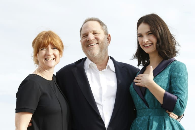 (From L) Executive producers Faith Penhale, Harvey Weinstein and British actress Lily James pose for photos of the TV series 'War and Peace' during the MIPCOM audiovisual trade fair in Cannes, southern France, in October 2015