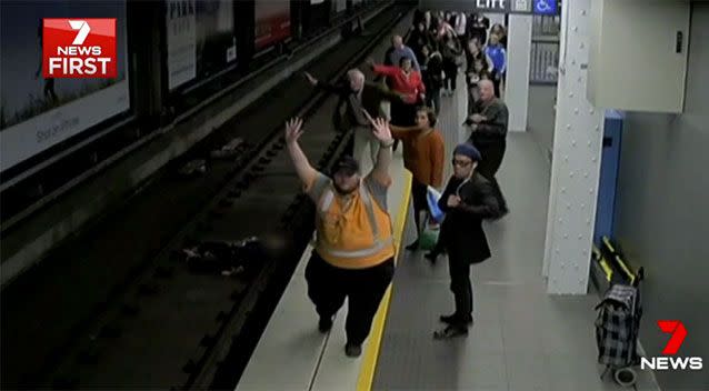 A staff member signals an emergency stop. Source: 7 News