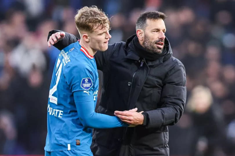 Manchester United legend Ruud van Nistelrooy embraces Everton defender Jarrad Branthwaite during his loan spell at PSV Eindhoven