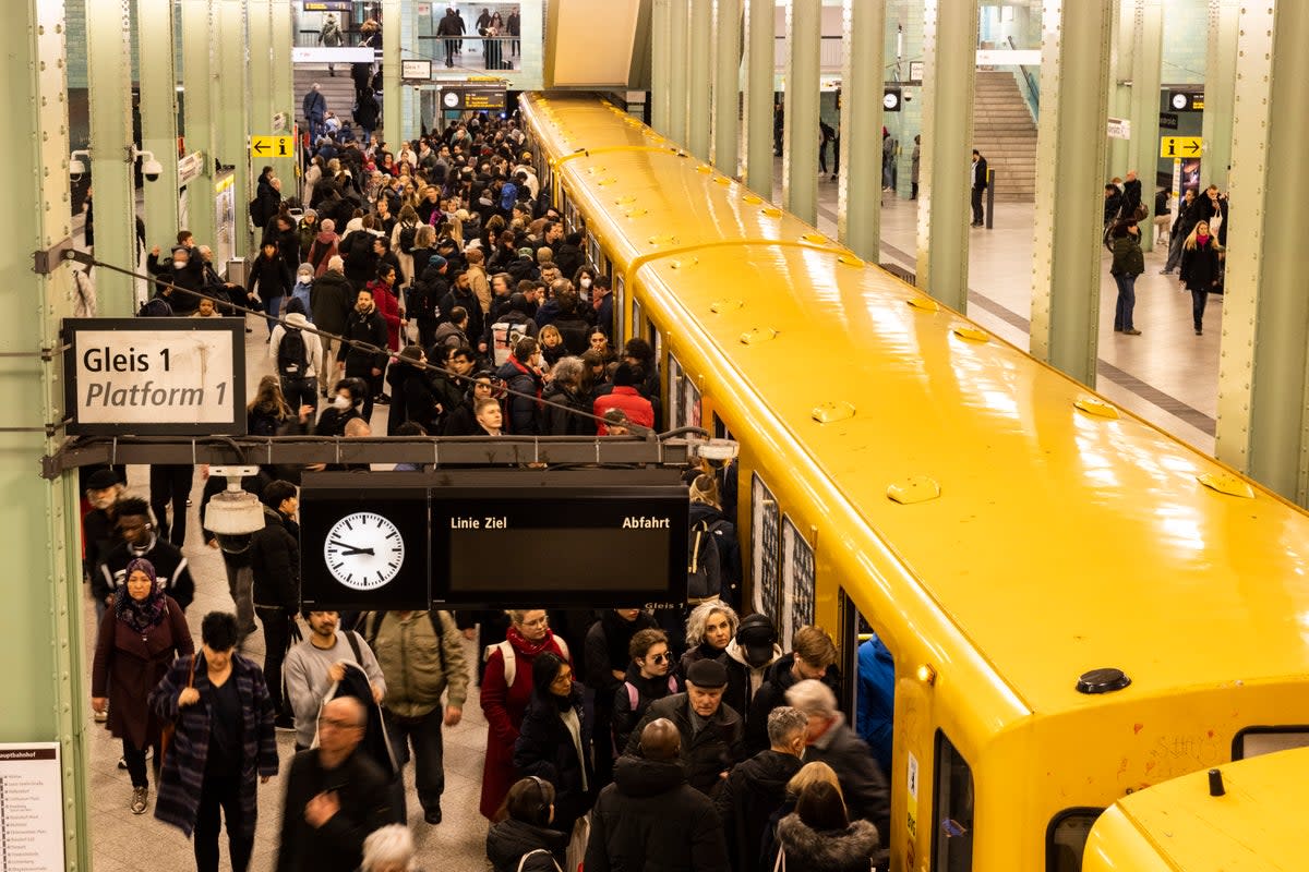 People commute via the unaffected underground U-Bahn service at Alexanderplatz (Getty Images)