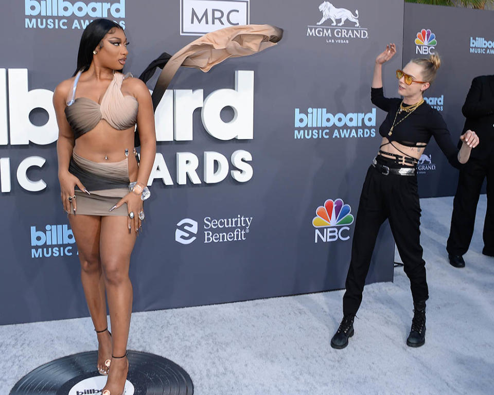 Megan Thee Stallion and Cara Delevingne on May 15, 2022 at the Billboard Music Awards. - Credit: gilbertflores@broadimage / MEGA