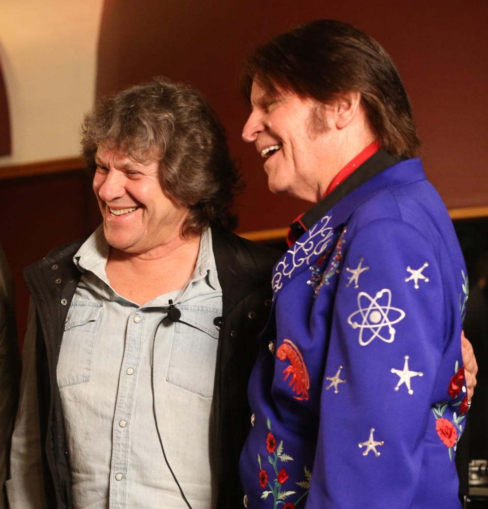 Michael Lang, left, poses with John Fogerty at an event introducing Woodstock 50's lineup of more than 70 performers.