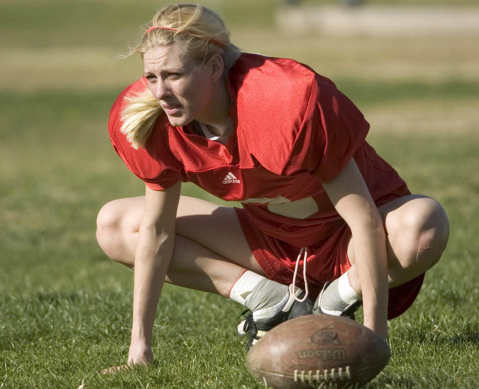 Katie Hnida stretches before practice with New Mexico.