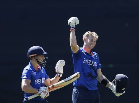 England's James Taylor (L) reacts next to team mate Joe Root who celebrates reaching his century during their Cricket World Cup match against Sri Lanka in Wellington, March 1, 2015. REUTERS/Anthony Phelps