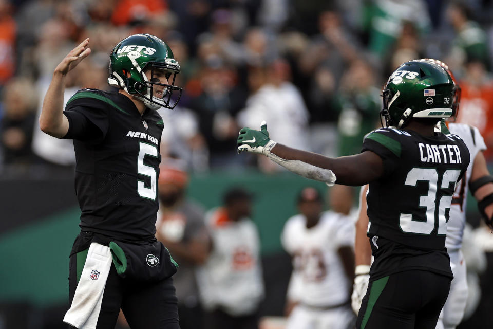 New York Jets quarterback Mike White (5) reacts after defeating the Cincinnati Bengals in an NFL football game, Sunday, Oct. 31, 2021, in East Rutherford, N.J. (AP Photo/Adam Hunger)