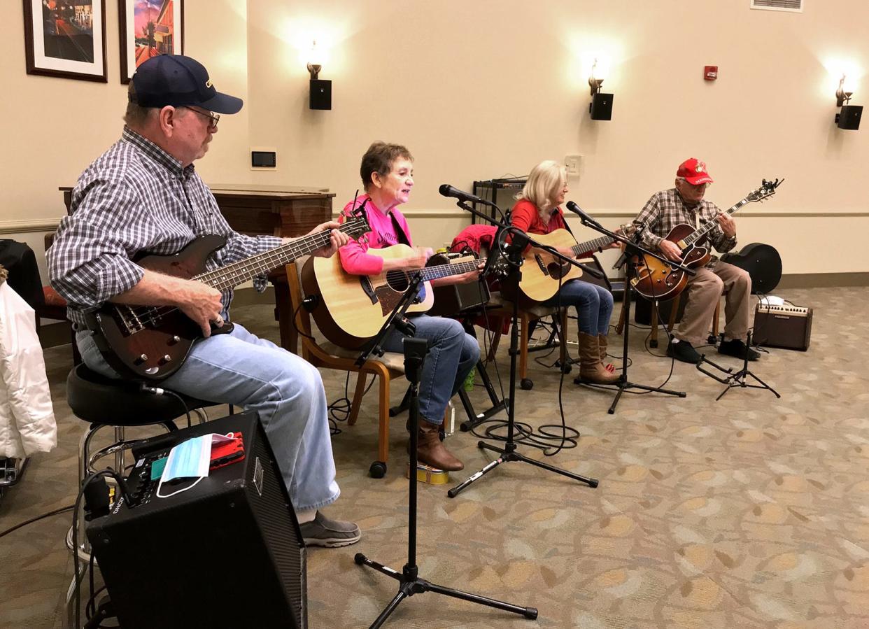 SourcePoint members (from left) Ted Breece, Karen Hinkle, Ellie Milligan and Paul Howard perform with the band Summertime for a Friday lunch crowd at the SourcePoint facility, 800 Cheshire Road in Delaware, on Jan. 14.