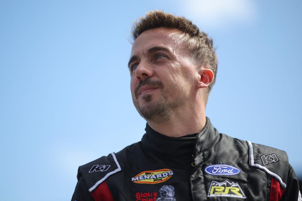 DAYTONA BEACH, FLORIDA - FEBRUARY 18: Frankie Muniz, driver of the #30 Hair Club Ford, walks the grid prior to the ARCA Menards Series BRANDT 200 Supporting Florida FFA at Daytona International Speedway. (Photo by James Gilbert/Getty Images)