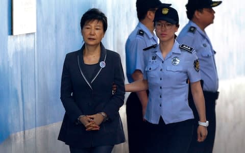 Former President Park Geun-hye, pictured here in 2017, did not attend her sentencing in April 2018 - Credit: Ahn Young-joon/AFP