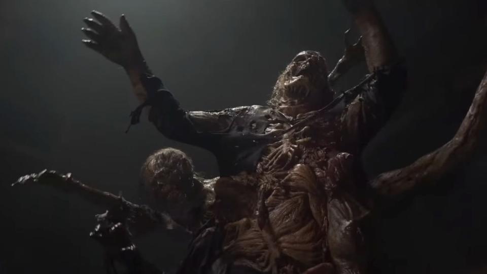 a group of Walking Dead walkers fused together for one giant walker in dead city trailer