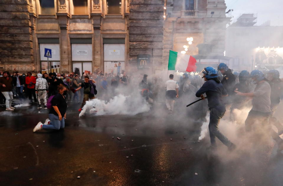 Demonstrators clash with police during a protest against the government's introduction of the 