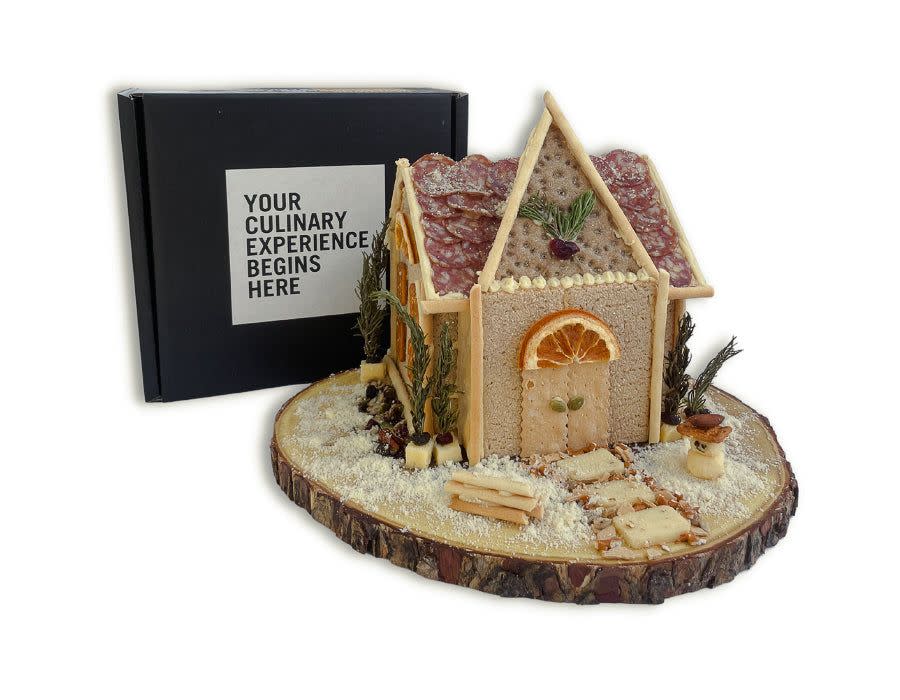 <p><strong>Edible Architecture</strong></p><p>Edible Architecture</p><p><strong>$129.95</strong></p><p>Charcuterie boards are decidedly "in," and they're decidedly more "adult-friendly" than candy-coated gingerbread houses. So before your next holiday party, why not construct a whole charcuterie village (or just a single chalet) using Edible Architecture's handy kit. You could even order a few of these fun holiday scene houses to construct with your guests, alongside a couple bottles of wine, of course. </p>
