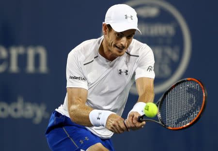 Aug 18, 2016; Mason, OH, USA; Andy Murray (GBR) returns a shot against Kevin Anderson (USA) on day six during the Western and Southern tennis tournament at Linder Family Tennis Center. Mandatory Credit: Aaron Doster-USA TODAY Sports