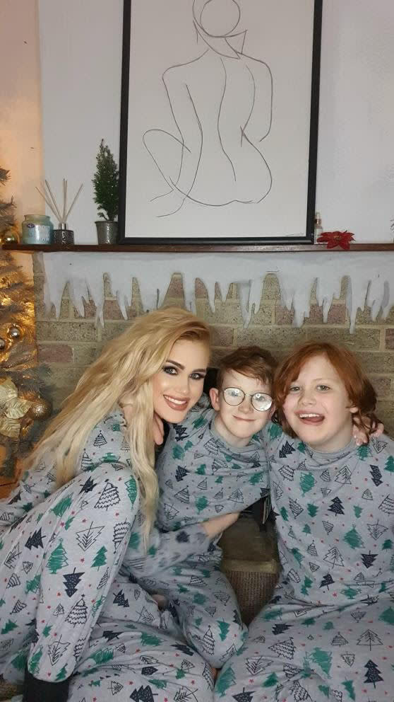 Kimberley with her sons, Harley and Hugo dressed in Christmas pyjamas.