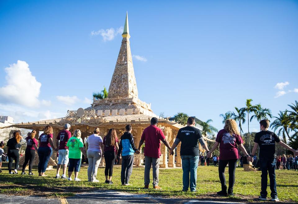 Coral Springs residents at the opening of “Temple of Time” by David Best. The installation is one of five temporary installations to bring the community together in collective healing and reflection following the Marjory Stoneman Douglas High School shooting in February of 2018.
