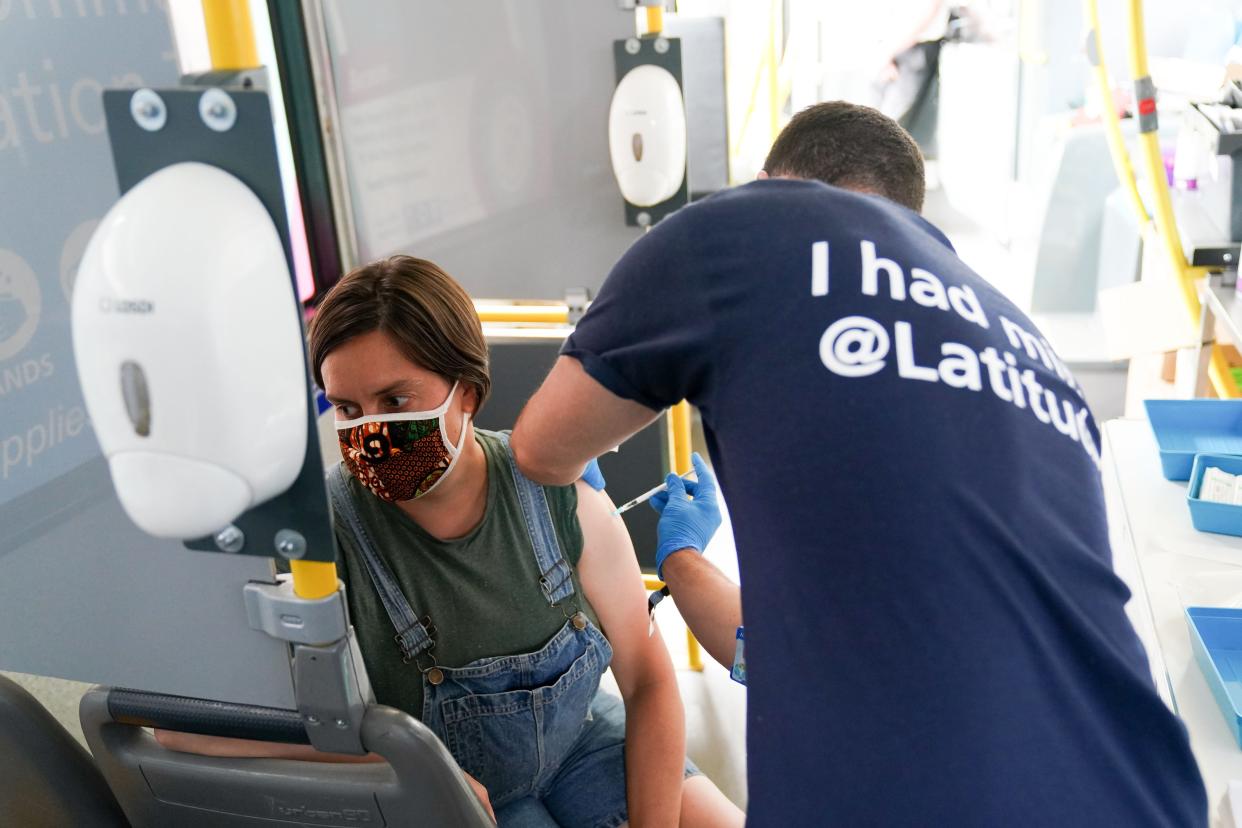 Felicity Perry receives her second dose of a Covid-19 vaccine on board a vaccination bus at the Latitude festival in Henham Park, Southwold, Suffolk (Jacob King/PA) (PA Wire)