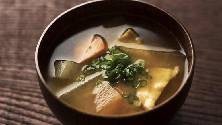 brown bowl of miso soup